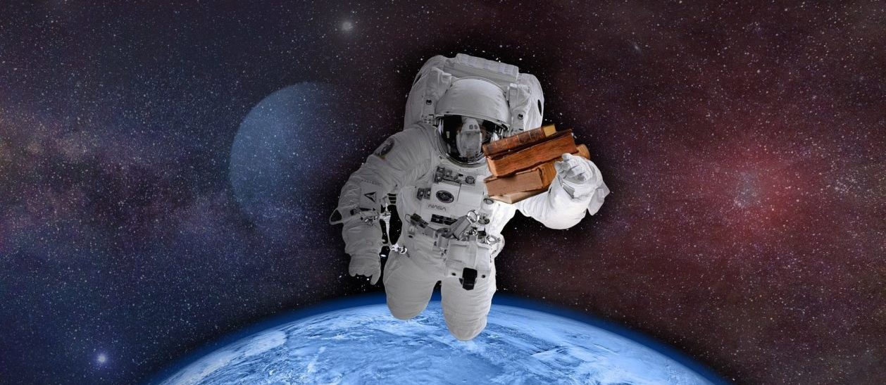 Astronaut holding books